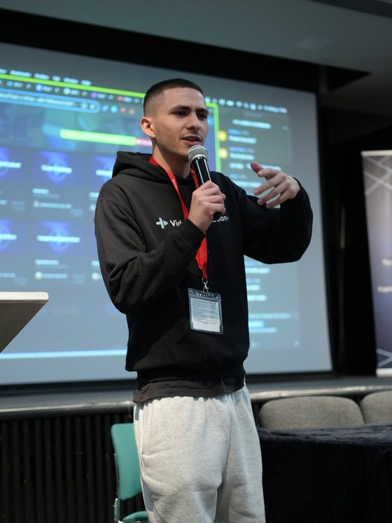 Jack Cole speaking on stage at a VP+ event